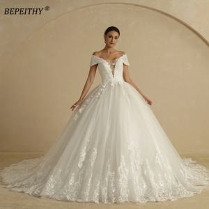 BEPEITHY 사용자 정의 섹시한 딥 브이 넥 볼 웨딩 드레스 2025 신부 민소매 코트 기차 반짝이 아이보리 신부 가운 여성을위한