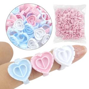 100 PCS 일회용 하트 모양의 플라스틱 접착제 링 컵 속눈썹 연장 문신 안료 홀더 팔레트 래쉬 메이크업 용품 도구