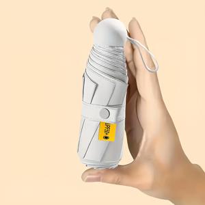 TEMU 6-Rib 미니 캡슐 우산, UV 보호 접이식 우산, 패션과 캐주얼 여행을 위한 필수품, 원형 헤드 디자인의 수동 오픈, 편리한 휴대용 야외 우산, 선물로 선택할 수 있습니다.