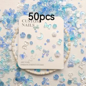 TEMU 블루 테마의 레진 네일 아트 액세서리 50/200 Mixed Bag, 리본, 하트, 카멜리아 등 요소가 포함되어 있습니다. DIY 네일 아트 아이템으로 다용도하고 스타일리시한 액세서리입니다. 쉽게 적용하고 오래 지속됩니다.