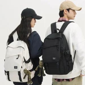 데일리 백팩 전면 이중포켓 캐주얼 대학생 가방 수납형 여행백팩 블랙 화이트 2컬러