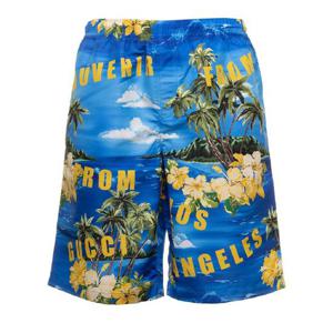 GUCCI 전체에 그래픽 프린트가 있는 라이트 블루 나일론 맨 소재의 수영 반바지 703548XHAF84464