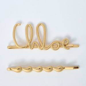 25 FW 끌로에 로고 모티프 골드톤 브라스 하드웨어 헤어 클립 CHC24WFT43CB79DC