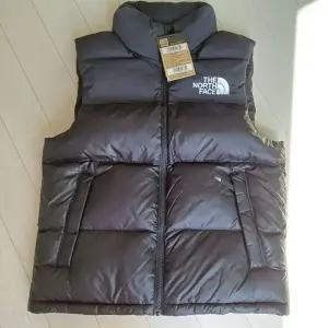 노스페이스 패딩 조끼 눕시 온볼 베스트 블랙