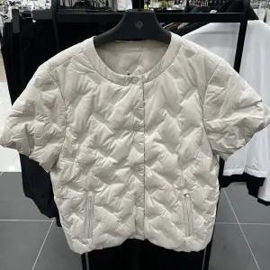 여성 레이어링 반팔 구스 다운 점퍼 RWDJN8381-508_IC