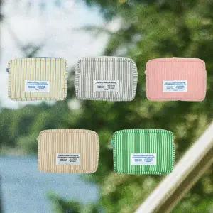 프롬디얼리던 패딩 스트라이프 파우치