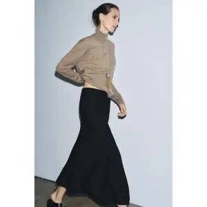 (MD PICK) ZARA 플레어 니트 미디 스커트 - 블랙 1822001800 130443