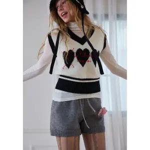 [에고이스트][BLUE LABEL]울혼방 하트 아가일 배색 니트 베스트(ER4OKV01)