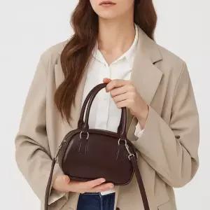 오릴리 미니 가죽 토트 손잡이 심플 모던 크로스 토트백 버킷백 M182