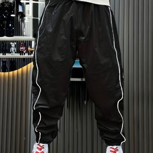 TEMU 봄과 여름을 위한 남성 스포츠 바지, 여유로운 핏과 타파드한 나인 포인트 바지, 가벼우면서 통기성이 좋은 퀵 드라이 캐주얼 롱 팬츠, 야외 훈련에 적합한 새로운 스타일, 모든 계절에 적합한 1개.