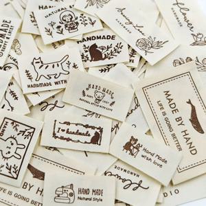 TEMU DIY 프로젝트용 수제 패브릭 라벨 30개 세트, 모자, 스카프, 가방 및 헤어 타이에 적합한 다양한 디자인의 재봉 태그, 창작품 장식 및 맞춤 제작에 이상적, 패브릭 태그 및 재봉 용품 액세서리(패턴 랜덤), 패브릭 라벨, 핸드메이드 라벨/태그, 의류 라벨, 패브릭 태그, 재봉 액세서리 및 공예품
