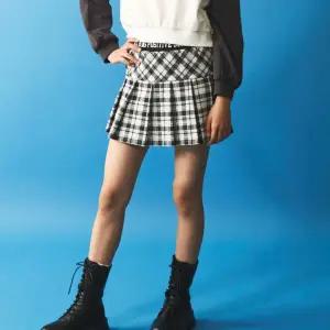 [롯데백화점]더데이걸즈 양면지밴딩체크플리츠스커트치마TGWH23T01