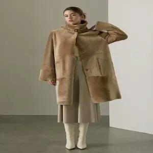 로보 리버시블 벨티드 롱 무스탕