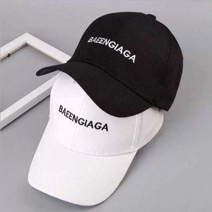 발렌시아가 볼캡 로고 모자 블랙 화이트