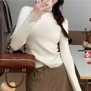 [하프클럽/]여성 레이어드 프릴 하이넥 골지 긴팔 니트 티셔츠