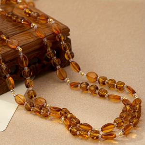 TEMU 여성을 위한 트렌디하고 스타일리시한 레이어드 비즈 목걸이. 카라멜 컬러의 빈티지 코트 스타일로, 독특한 디자인을 좋아하는 사람들에게 완벽합니다.