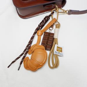 TEMU 1개 인조 가죽 뿔 가방, 초콜릿 스트랩 포함, 휴대폰, 에어팟, 키체인 보관에 적합, 멜랑쥬 컬러 스킴.