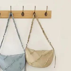 여성숄더백 곱창끈 크로스백 여성핸드백 여성크로스백 베이지 (WFK9AIZ)