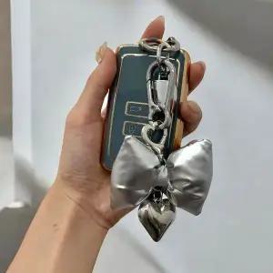 패딩키링 리본 실버 백꾸 리본키링 가방키링 핸드폰키 (WFKB5EM)