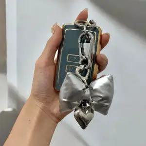 패딩키링 리본 실버 백꾸 리본키링 가방키링 핸드폰키 (WFKB5EM)