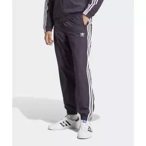 아디다스 ADIDAS 우븐 파이어버드 트랙 팬츠 - 딥퍼플 / IZ2412