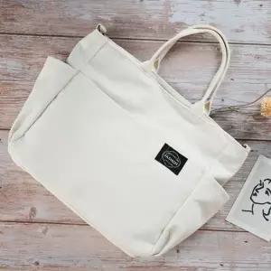 토트백 크로스 캐주얼 캔버스 데일리 가방 아이보리 (WFKDXXX)