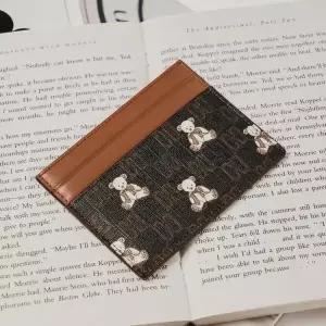 [롯데백화점]닥스 액세서리 (선물포장) 브라운 패턴 소가죽 카드홀더 (DCHO5E792W3)