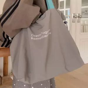 [엘루이즈][엘루이즈] 클란츠 레터링 스트링 나일론 에코백(4color)