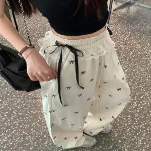 밴딩 WS40UR69 하이웨스트 레이스 리본 패턴 와이드팬츠 롱팬츠