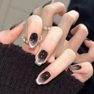 TEMU 10개입 블랙 스마일 고양이 눈 프레스온 네일. 손의 외모를 향상시키는 짧고 다재다능한 스타일로, 달콤하고 멋진 스타일을 연출합니다. 이 풀 커버 인조 네일은 여성에게 완벽하며, 간편하게 부착할 수 있고 자연스러운 손톱을 손상시키지 않습니다.