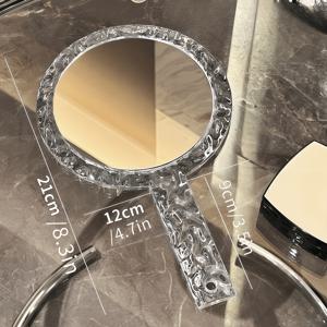 TEMU 물결 텍스처 디자인의 투명 휴대용 메이크업 거울. 휴대 가능하고 깨지지 않는 구조를 특징으로 합니다. 고화질 양면 거울 (1X/5X) 이 있으며 원형 및 사각형 모양으로 제공됩니다.