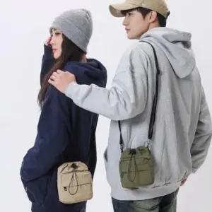 [패션] 크로스 워싱천미니복조리스트링백 스트릿 캐주얼백