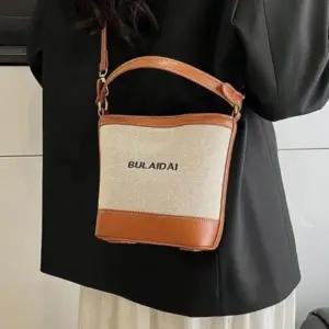 [다잇템] 여성 필기체 패브릭 쁘띠 버킷 숄더백
