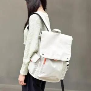 [신상오픈런]여성 경량 나일론 백팩 포켓 스트리트 스타일 학생용 가방 (38541935)