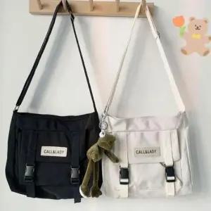 투버클 캔버스 크로스백 숄더백 로고패치 학원 대학생