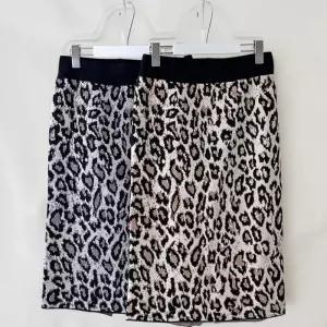 [신상오픈런]여성 레오파드 패턴 뒤트임 미디 스커트 밴딩 일자핏 (40953343)
