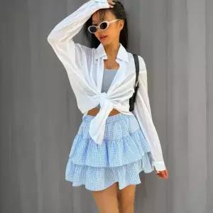 [신상오픈런]여성 사랑스러운 여름 휴가 스타일 체크 패턴 프릴 미니스커트 (34170974)