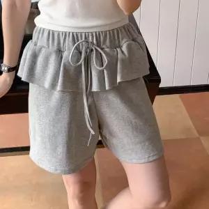 [다잇템]여자 고무줄 4부 트랙수트 프릴 숏치마 반바지 (35408922)