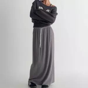 [신상오픈런]여성 골지 니트 롱스커트 뒷트임 스판 A라인 맥시 (41315877)