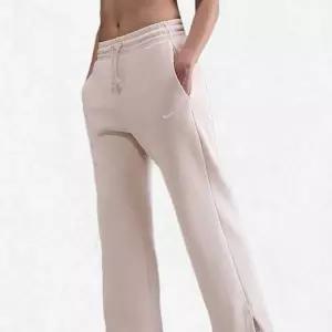 [나이키]스포츠웨어 플리스 여성 하이웨이스트 와이드 레그 팬츠 IH1012-104 2482591