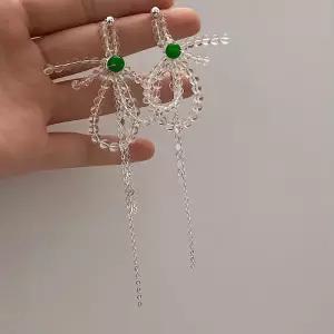 [디작소]여성 크리스탈 비즈 리본 태슬 롱 귀걸이 (36462206)