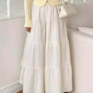 [디작소]여성 셔링 캉캉 리본 스트랩 나일론 롱 스커트 (33683031)