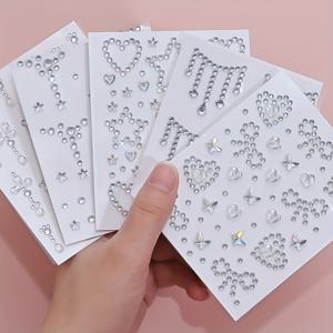 TEMU 5장의 3D 반짝이는 AB 페이스 Gem 스티커 (하트, 나비 디자인). 이 자체 접착식 글리터 라인스톤 스티커는 얼굴 및 손톱 장식에 완벽하며, 바디 아트 및 축제 행사에 이상적입니다.