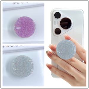 TEMU 2개 세트 스타라이트 반짝이는 다기능 360° 회전 접이식 폰 스탠드. 고품질 고투명 수지로 제작되어 손으로 정교하게 레이어링 및 주조되었습니다. 조명이 비추면 섬세하고 부드러운 샌드 핑크 색상이 꿈결 같은 오로라 같은 반짝임을 보여주며 변화하고 흐릅니다. 모든 각도에서 독특한 스타라이트 반짝임을 드러냅니다