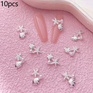 TEMU 10개 세트의 여름 테마 바다 바람 네일 장식. 골드 및 실버 진주, , 조개 디자인 특징. 네일 아트 프로젝트에 완벽하며, 3D 합금으로 제작된 이 장식품은 네일, 신발 장식과 같은 다양한 공예에 사용할 수 있습니다.