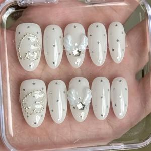 TEMU 10개 숏 아몬드 네일, 핸드메이드 누름식 인조네일 세트, 별, 조개껍질, 라인스톤 장식이 있는 순백색. 체인. 결혼식 하객, 발렌타인데이에 완벽. 인조 손톱. 우아함을 추구하는 & 코켓 미학 애호가에게 이상적