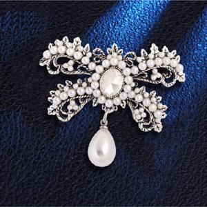 TEMU 여성을 위한 시크하고 고급스러운 액세서리로 디자인된 레트로 스타일 브로치. 모조 진주와 반짝이는 라인스톤이 특징이며, 우아하고 독특한 리본 디자인을 선보입니다. 중성적인 의상에 적합합니다.