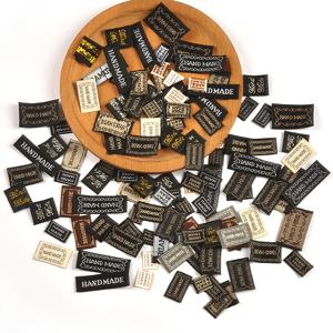 TEMU 100개 미니 패브릭 라벨, 크기 약 1-5cm, 색상은 검정색이며 'Handmade'라는 단어가 적혀 있습니다. 가방, 스카프 등 프로젝트에 적합하며 접착제가 없습니다. 색상은 무작위로 혼합됩니다.
