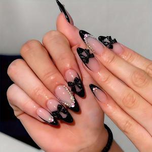 TEMU 블랙 프렌치 팁과 3D 리본 매듭 장식, 라인스톤이 장식된 중간 크기의 아몬드 모양의 24개 미디엄 알몬드형 프레스온 네일 세트입니다. 이 광택 풀 커버 네일은 스타일로 디자인되었습니다.