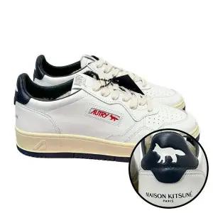 [AUTRY]오트리 남성 메달리스트 레더 스니커즈 화이트 네이비 145903274